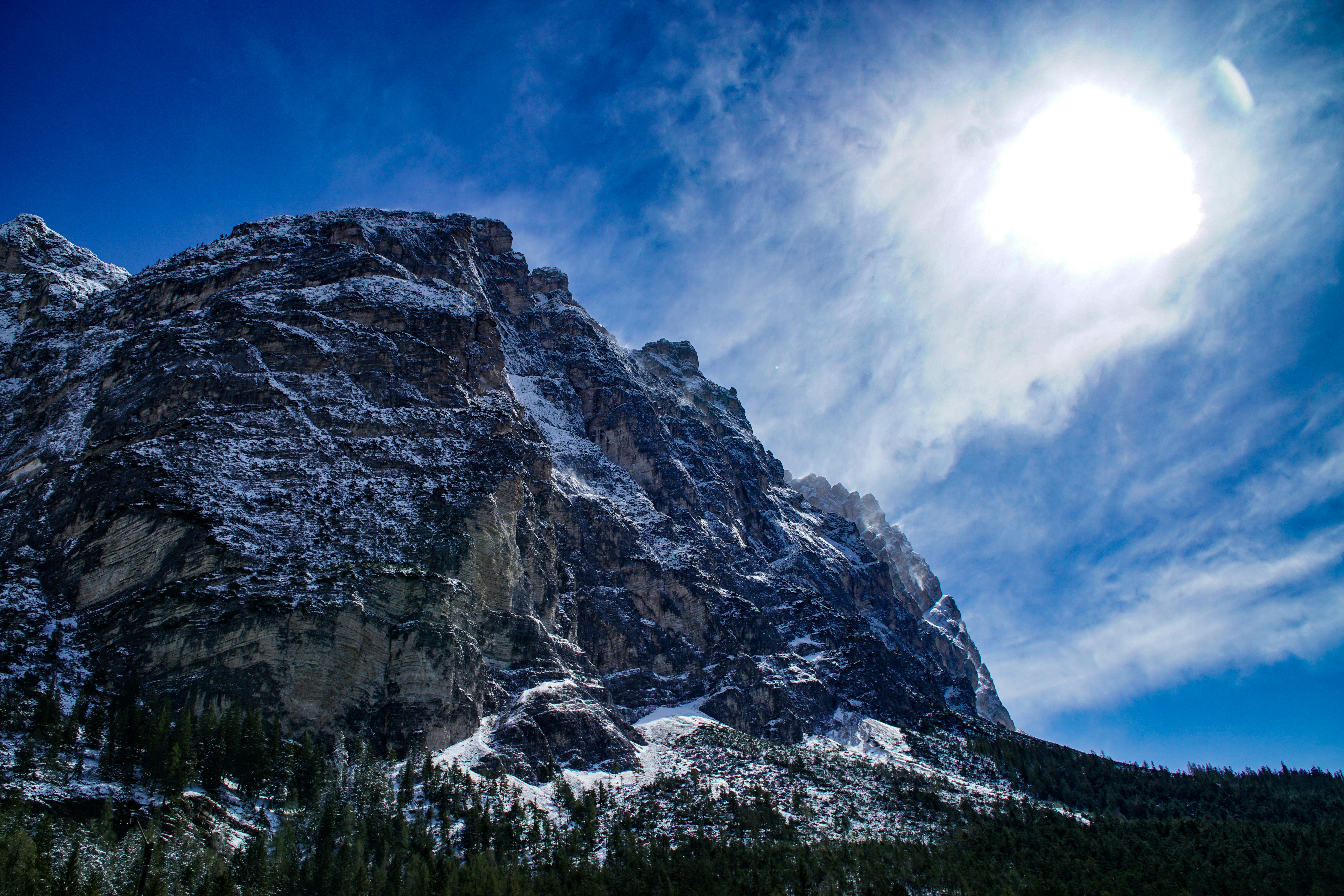 gray rocky mountain under clear blue sky